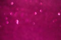A pink background with many small circles