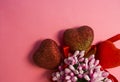Pink background. St. Valentine`s Day. Red hearts in spangles with bows. Love. Bouquet of flowers. The place for an inscription. Royalty Free Stock Photo
