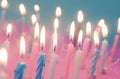 a pink background with white and blue candles Royalty Free Stock Photo