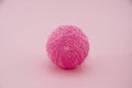 Pink ball from garland made of cotton threads or yarn Royalty Free Stock Photo