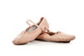 Pink ballet slippers on white
