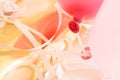 Pink balloons tied to white string, close up, on gold blurred background.