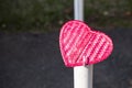 Pink bamboo wood heart over blurred background, morning outdoor day light