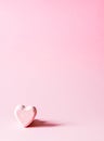 Pink bath bomb in the shape of heart on soft pastel background Royalty Free Stock Photo