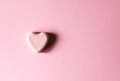 Pink bath bomb in the shape of heart on soft pastel background Royalty Free Stock Photo