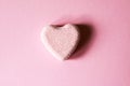 Pink bath bomb in the shape of heart on soft pastel background Royalty Free Stock Photo