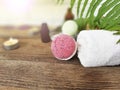 Pink bath bomb with towel  on wooden background Royalty Free Stock Photo