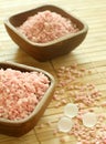 Pink bath salts in wooden bowls. Royalty Free Stock Photo
