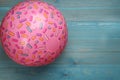 Pink beach ball on light blue wooden background, top view. Space for text Royalty Free Stock Photo