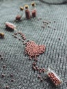 Pink beads laid out in the shape of a heart