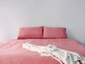 Pink bedding on double bed