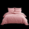 Pink Bedding Set With Two Pillows and a Comforter on a White Background in a Simple Arrangement Royalty Free Stock Photo