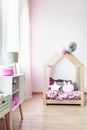 Pink bedroom with handmade bed Royalty Free Stock Photo