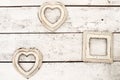 pink, beige old photo frames on a wooden background. in the shape of a heart. wall, interior Royalty Free Stock Photo