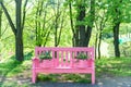 Pink bench in the green park
