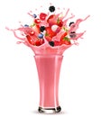 Pink berry juice splash. Whole and sliced strawberry, raspberry, cherry, blueberry and blackberry in a sweet juce or cocktail with Royalty Free Stock Photo