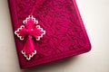 Pink Bible with handmade pink cross on it