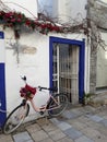 A Pink bicycle standing on the street in Bodrum