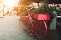 Pink bike on the street.