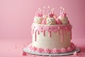 Pink Birthday Cake With Lit Candles and Elegant Decoration Against a Pink Background Royalty Free Stock Photo
