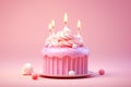 Pink Birthday Cake with Lit Candles and Sprinkles Royalty Free Stock Photo
