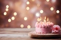 Pink Birthday Cake With Lit Candles on Wooden Table Against Bokeh Light Background Royalty Free Stock Photo