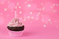 Pink birthday cupcake with lights Royalty Free Stock Photo