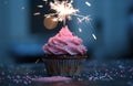 pink birthday cupcake with a sparkler Royalty Free Stock Photo