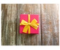 Pink Birthday present box on wooden background. Season`s  gifts for women and girls. Merry Christmas and Happy New Year holidays Royalty Free Stock Photo