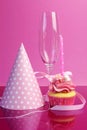 Pink birthday table settings with champagne glass Royalty Free Stock Photo