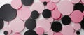 Pink and black circles creating abstract geometric background