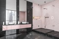 Pink and black shower room. Corner view