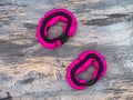 Pink and black weights, hand bracelets on a gray background, top view Royalty Free Stock Photo