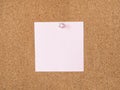 Pink blank note paper pinned to cork board Royalty Free Stock Photo