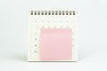 Pink blank sticky note with copy space for putting text on calendar on white background, busy work reminder, annual leave, project Royalty Free Stock Photo