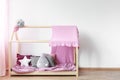 Pink blanket on girls bed Royalty Free Stock Photo