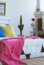 Pink blanket on king-size bed Royalty Free Stock Photo