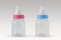 Pink and blue baby bottles - Male or female? Concept of future baby gender Royalty Free Stock Photo