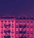 Pink and blue buildings with empty sky above in New York City