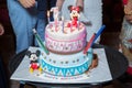 Pink and blue cake. Aque one . Happy Birthday . One cake. Mickey Mouse