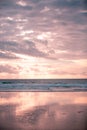 Pink and Blue: Cloudy Sky and Ocean with their Reflection on Wet Sands Royalty Free Stock Photo