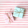 Pink and blue gift box on a pink background .