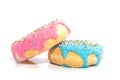 A pink and a blue glazed donut Royalty Free Stock Photo