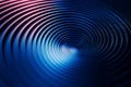 Pink and blue gradient illuminating a metallic vortex, creating a captivating visual effect