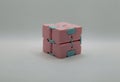 Pink and blue infinity cube with white background