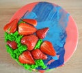 Pink and blue mirror glaze mousse cake with berries and sponge bisquit. Homemade strawberries cake