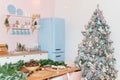 Pink and blue pastel modern kitchen interior decorated with Christmas tree and decorative elements. New Year decorations, Happy Royalty Free Stock Photo