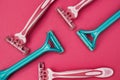 Pink and blue razors for women on a pink background Royalty Free Stock Photo