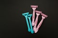 Pink and blue razors for women on a black background Royalty Free Stock Photo