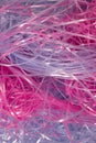 Pink and Blue shredded plastic fake Easter grass background